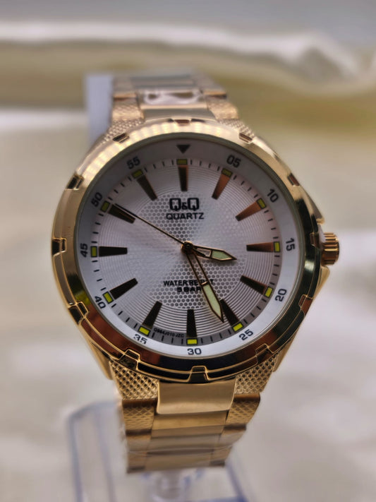RELOJ QYQ DORADO